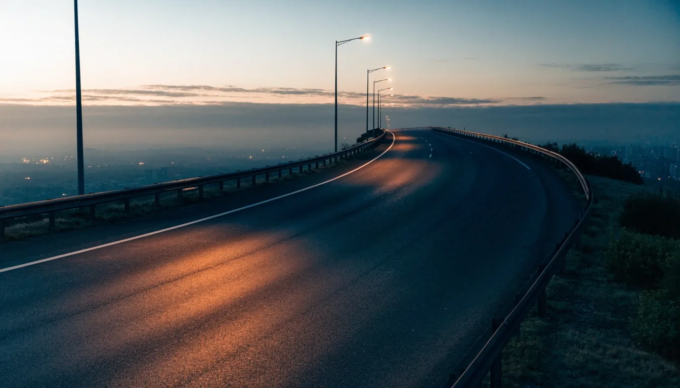 A Dubai arterial road before sunset, lamp shadows falling across the carriageway