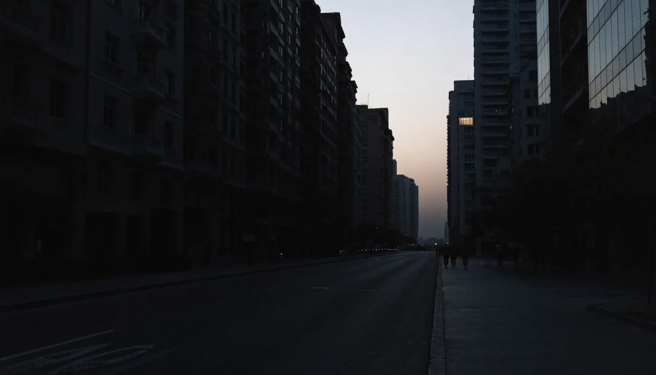 Gulf city corridor at last light, low-key grade with warm window key and deep foreground shadow